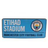 https://imageoffloads.taylorsmerchandise.com/wp-content/uploads/111915-Manchester-City-FC-Street-Sign-BL.jpg