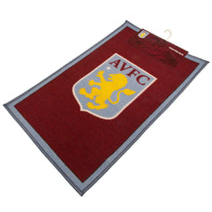 Aston Villa FC Rug LKT Sport Bright colourful bedroom rug featuring a large central club crestMade from 100% polyamide with a non-slip backingMachine washableOfficial licensed productApprox 80cm x 50cm Rugs