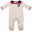 England FA Sleepsuit 82 Retro 3-6 Mths LKT Sport This long sleeved baby sleepsuit features England's traditional white home coloursDesign inspired by the 1982 world cup kit with an embroidered crestSoft comfortable fit with press stud fasteningMade from 1