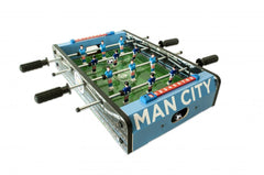 Manchester City FC 20 inch Football Table Game LKT Sport Table top, football game in a stadium and pitch design 6 players per team in sky or royal blue Sturdy construction with grass effect printed pitch A score indicator on each side Complete with two pl