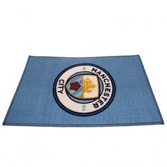 Manchester City FC Rug LKT Sport Bright colourful bedroom rug featuring a large central club crest Made from 100% polyamide with a non-slip backing Machine washable Official licensed product Approx 80cm x 50cm On a header card Rugs