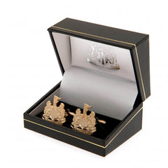 Newcastle United FC Gold Plated Cufflinks LKT Sport Gold Plated crest shaped cufflinksFeaturing a highly detailed formed Newcastle crestOn a bullet back fixingOfficial licensed productApprox 22mm x 22mm Cufflinks