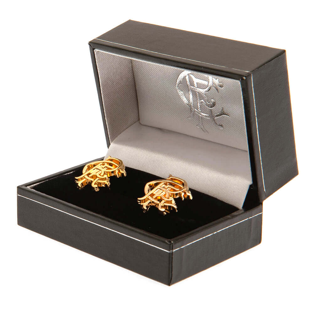 Rangers FC Gold Plated Scroll Crest Cufflinks LKT Sport Gold Plated crest shaped cufflinksFeaturing a highly detailed Rangers FC scroll crestOn a bullet back fixingOfficial licensed productApprox 20mm x 16mm Cufflinks