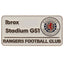 Rangers FC Street Sign Badge LKT Sport Metal street sign design pin badgeDie stamped design with full colour enamel infillWith butterfly clasp fixingsMetal alloy with silver style finishOfficial licensed productApprox 40mm x 20mm Pins