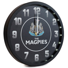 https://imageoffloads.taylorsmerchandise.com/wp-content/uploads/TM-04265-Newcastle-United-FC-Metallic-Wall-Clock-Black-2.jpg