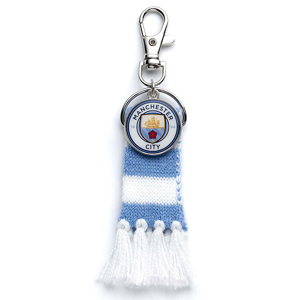 https://imageoffloads.taylorsmerchandise.com/wp-content/uploads/TM-06372-Manchester-City-FC-Blue-Bar-Scarf-Bag-Charm-1.jpg