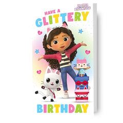 https://imageoffloads.taylorsmerchandise.com/wp-content/uploads/TM-07280-Gabbys-Dollhouse-Glittery-Birthday-Card.jpg