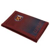 West Ham United FC Fade Wallet LKT Sport Fade design wallet featuring WHUFC text and full colour club crest5 separate internal compartmentsExternal zipped pocketWipe clean polyesterOfficial licensed productApprox 12cm x 8cm closed Wallets