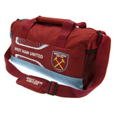 West Ham United FC Flash Duffle Bag LKT Sport Flash design duffle bag featuring West Ham text and club crestLarges zipped opening for easy accessAdditional zipped and mesh end pocketCarry handles and adjustable shoulder strapRubber zip pulls featuring rai