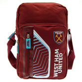 West Ham United FC Flash Shoulder Bag LKT Sport Flash design shoulder bag featuring West Ham text and club crestMain compartment has a large double zipped opening for easy access2 front zip pockets and interior open pocketAdjustable shoulder strapRubber z