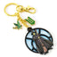 Wicked Elphaba Window Charm Keyring LKT Sport Metal die stamped charm keyring with chain and split ringFeaturing Elphaba in front a charming window backdropMetal alloy with gold style finishOfficial licensed productApprox 50mm x 50mm Keychains
