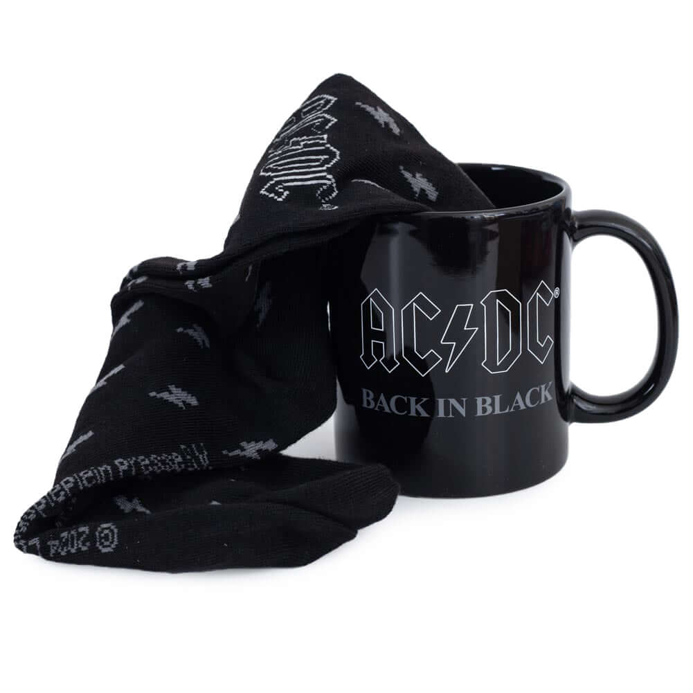 AC/DC Mug & Sock Set LKT Sport Classic mug and sock gift setRock Out with your matching coffee mug and socks!Black mug and socks both featuring the iconic "Back In Black" album designOfficial licensed productMug approx 315ml (11oz)Socks size 6-11 UK (40-4 Imagen principal del producto