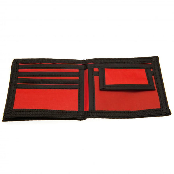 Arsenal FC Canvas Wallet LKT Sport Red wallet with black trim featuring full colour Arsenal club crest Internal window compartment and 2 zipped pockets 9 additional separate internal compartments Wipe clean polyester Official licensed product Approx 11cm