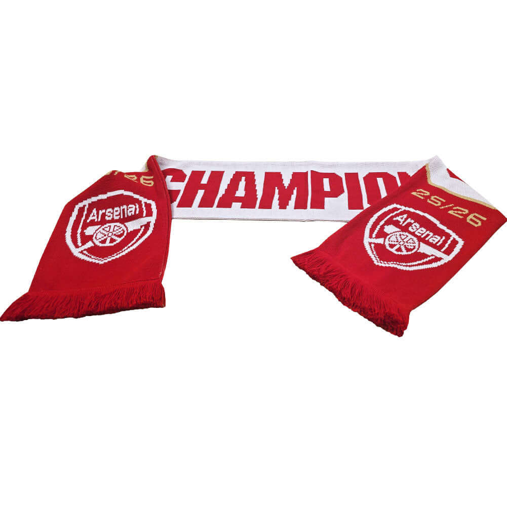 Arsenal FC Champions Scarf LKT Sport Red and white jacquard knit scarf with white fringeWith Champions 25/26Both sides feature a large Arsenal club crest at each endOfficial licensed productApprox 132cm x 19cm Scarves