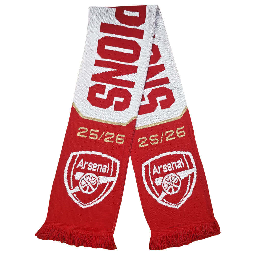 Arsenal FC Champions Scarf LKT Sport Red and white jacquard knit scarf with white fringeWith Champions 25/26Both sides feature a large Arsenal club crest at each endOfficial licensed productApprox 132cm x 19cm Scarves