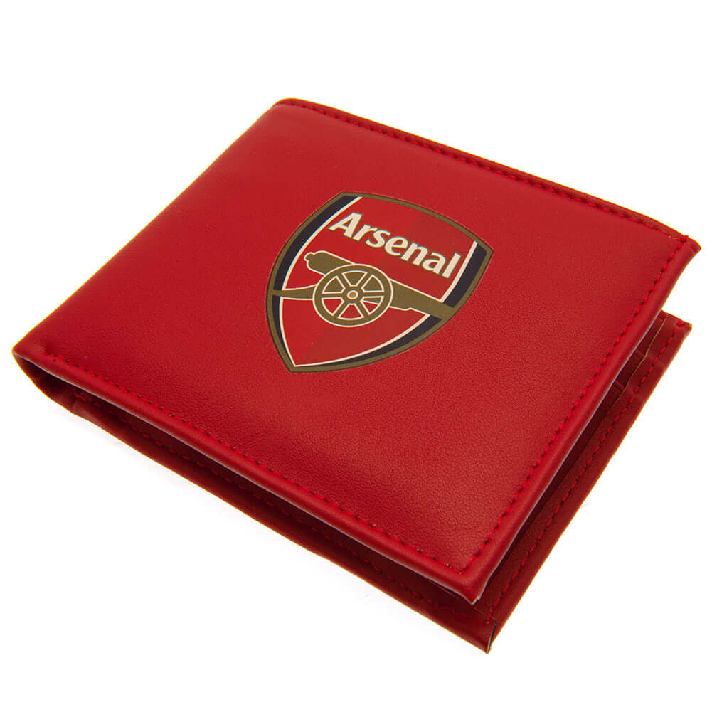 Arsenal FC Coloured PU Wallet LKT Sport Coloured PU wallet featuring a large printed club crest3 card slots, a window slot and 2 note pocketsChange pocket with secure stud fastener2 additional compartmentsOfficial licensed productApprox 11cm x 9cm Wallets