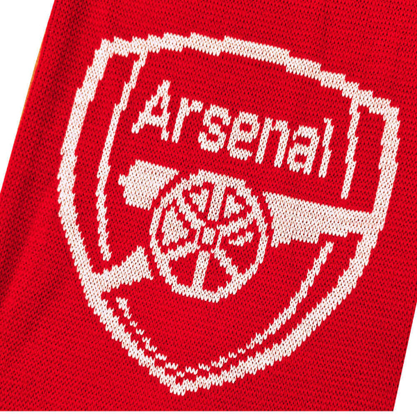 Arsenal FC Gold Premier League Champions Scarf LKT Sport Red and white jacquard knit scarf with gold fringeWith Champions 25/26 text in white and goldBoth sides feature a large Arsenal club crest and Premier League trophy at each endOfficial licensed prod