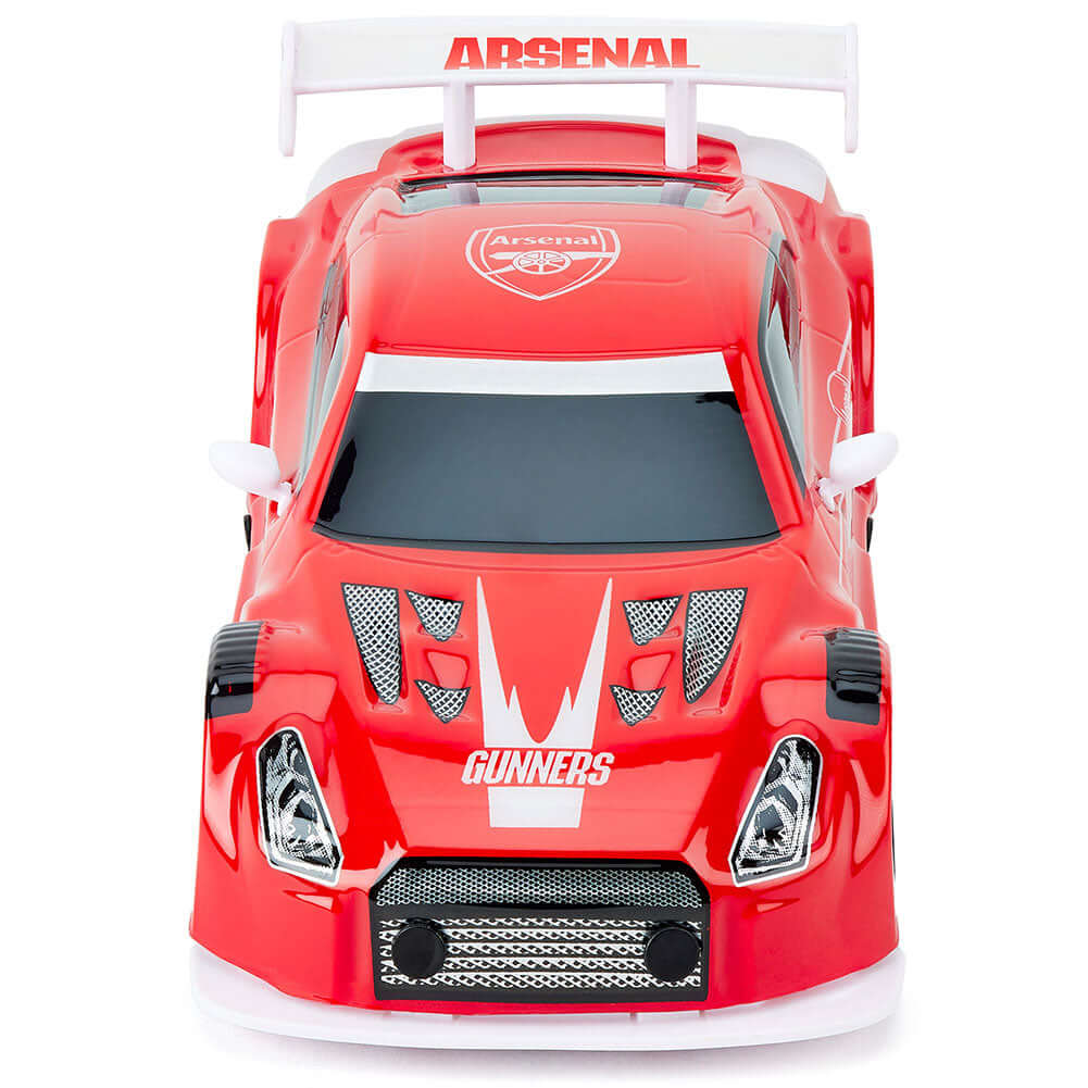 Arsenal FC Radio Control Sportscar 1:24 Scale LKT Sport Sleek and streamlined sportscar with iconic style brandingComplete with Arsenal FC crests on the roof and doorsIncludes an oversized spoiler on the rear for stability and speedWorking spring suspensi