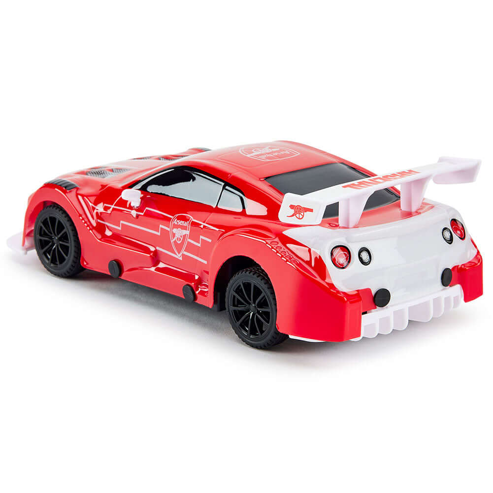 Arsenal FC Radio Control Sportscar 1:24 Scale LKT Sport Sleek and streamlined sportscar with iconic style brandingComplete with Arsenal FC crests on the roof and doorsIncludes an oversized spoiler on the rear for stability and speedWorking spring suspensi