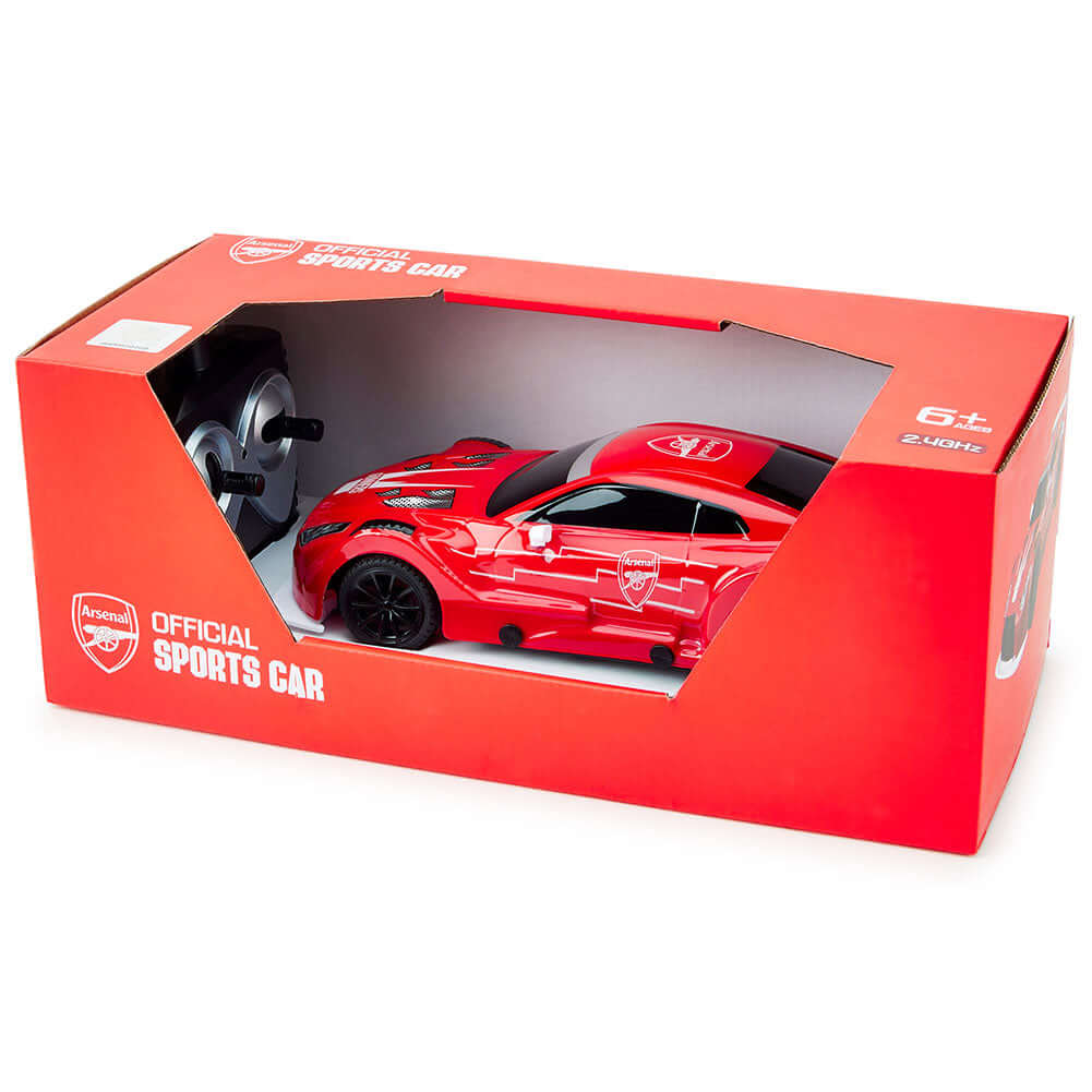 Arsenal FC Radio Control Sportscar 1:24 Scale LKT Sport Sleek and streamlined sportscar with iconic style brandingComplete with Arsenal FC crests on the roof and doorsIncludes an oversized spoiler on the rear for stability and speedWorking spring suspensi