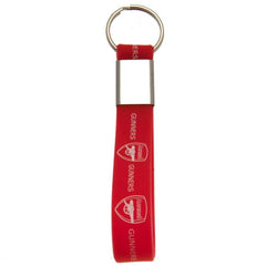 Arsenal FC Silicone Keyring LKT Sport Silicone strap keyring with silver colour metal band and split ringVibrant red strap with crest and gunners designOfficial licensed productApprox 10cm x 1.5cm Keychains
