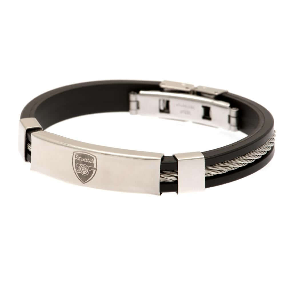 Arsenal FC Silver Inlay Silicone Bracelet LKT Sport Stylish black silicone bracelet with a silver colour rope insertWith a stainless steel crest plate featuring the club logoStainless steel deployment claspOfficial licensed productApprox 20cm x 1cm Bracel