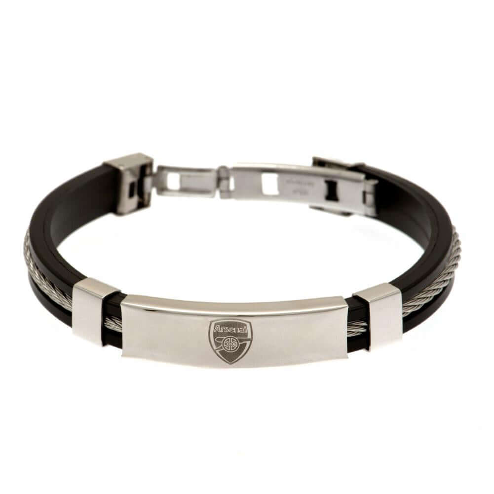 Arsenal FC Silver Inlay Silicone Bracelet LKT Sport Stylish black silicone bracelet with a silver colour rope insertWith a stainless steel crest plate featuring the club logoStainless steel deployment claspOfficial licensed productApprox 20cm x 1cm Bracel