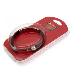 Arsenal FC Silver Inlay Silicone Bracelet LKT Sport Stylish black silicone bracelet with a silver colour rope insertWith a stainless steel crest plate featuring the club logoStainless steel deployment claspOfficial licensed productApprox 20cm x 1cm Bracel