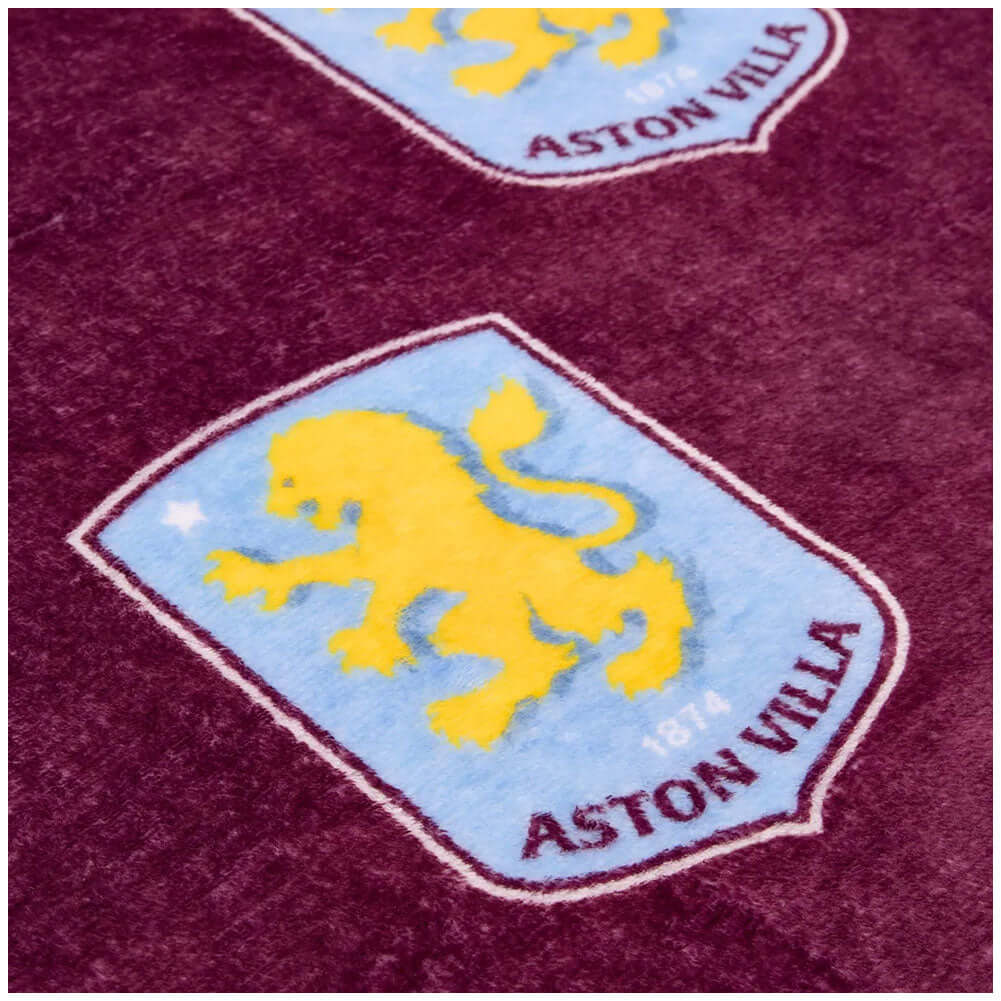 Aston Villa FC Multi Crest Fleece Blanket LKT Sport Vibrant claret soft and warm fleece blanketFeatures multiple Villa crests100% polyester machine washableOfficial licensed productApprox 150cm x 120cm Throw Blankets