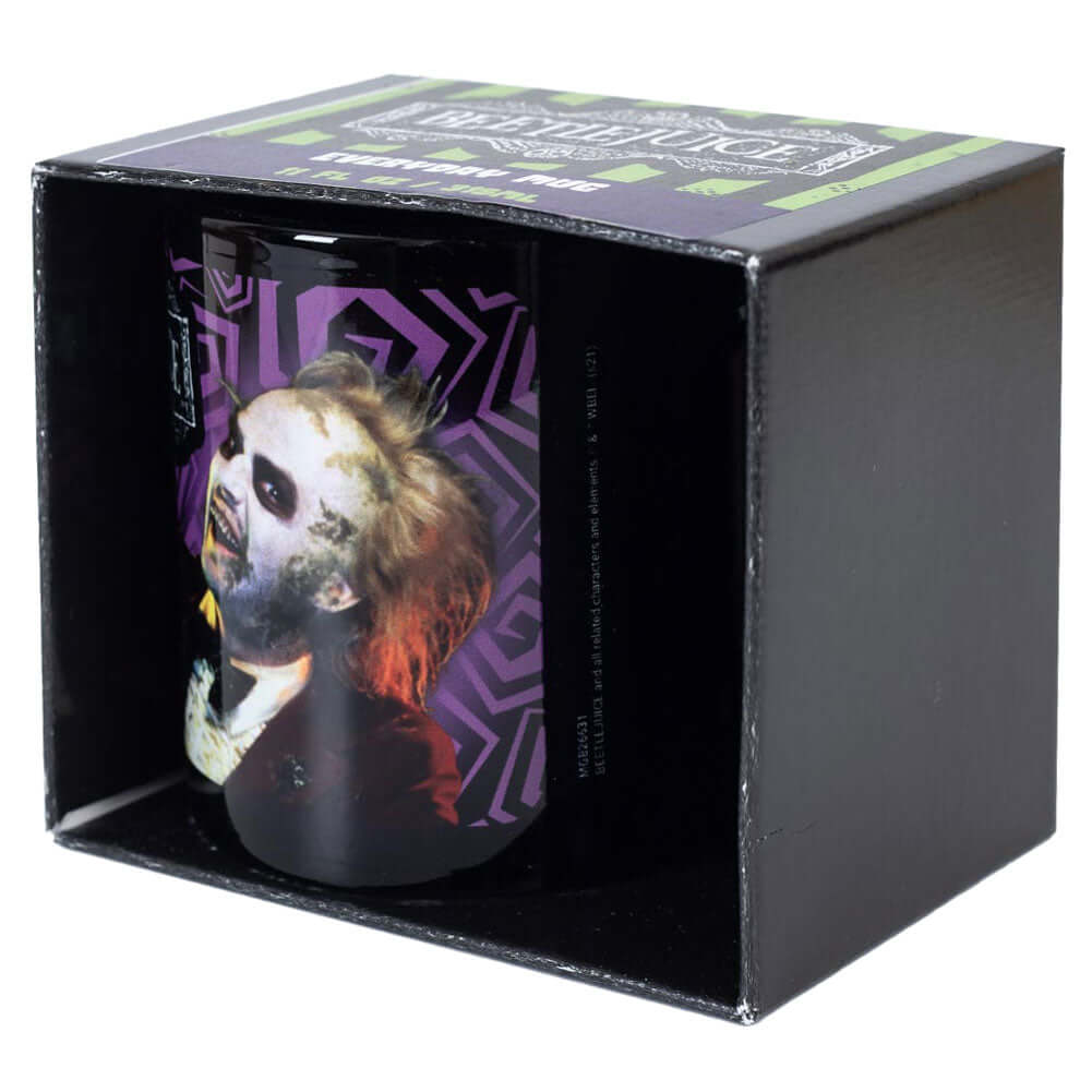 Beetlejuice Mug LKT Sport Ceramic everyday coffee mugBlack mug with an image of a smiling Beetlejuice and the text 'THE GHOST WITH THE MOST' around the mugGlazed kiln fired finishOfficial licensed productApprox 315ml (11oz)Approx 9cm tall, 8cm in diameter