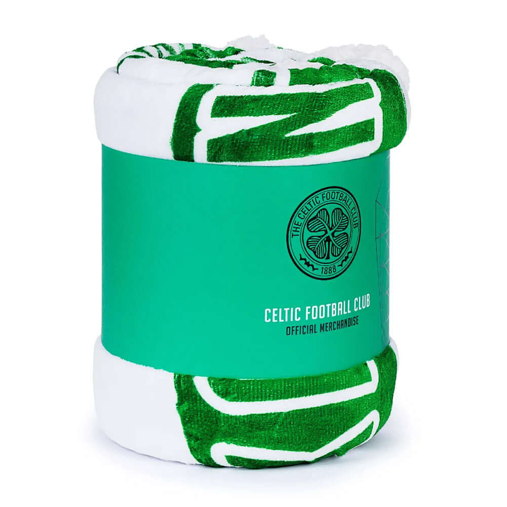Celtic FC Sherpa Fleece Blanket LKT Sport Featuring a vibrant Celtic green and white stripe detail with a colour crest in the middle, includes the words 'You'll never walk alone' underneathLuxury super soft and warm white sherpa fleece reverse100% polyest