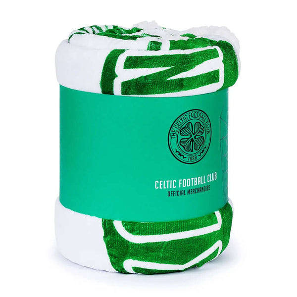 Celtic FC Sherpa Fleece Blanket LKT Sport Featuring a vibrant Celtic green and white stripe detail with a colour crest in the middle, includes the words 'You'll never walk alone' underneathLuxury super soft and warm white sherpa fleece reverse100% polyest