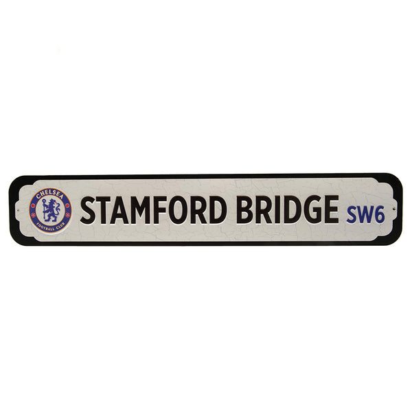 Chelsea FC Deluxe Stadium Sign LKT Sport Deluxe metal stadium sign with embossed club logo and textOn a black MDF backingReady to hang with two picture hooksOfficial licensed productApprox 65cm x 12cm Novelty Signs