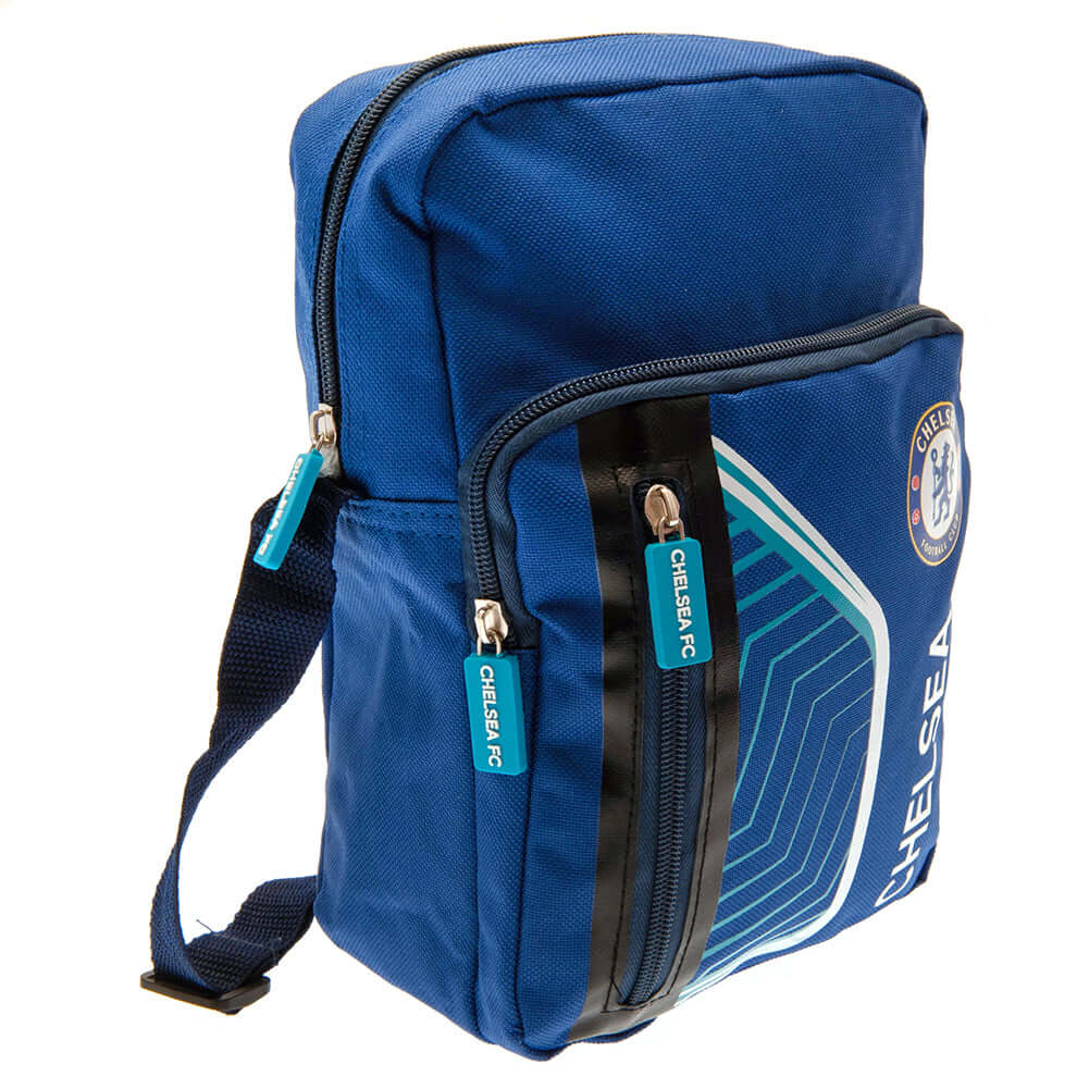 Chelsea FC Flash Shoulder Bag LKT Sport Flash design shoulder bag featuring Chelsea text and club crestMain compartment has a large double zipped opening for easy access2 front zip pockets and interior open pocketAdjustable shoulder strapRubber zip pulls