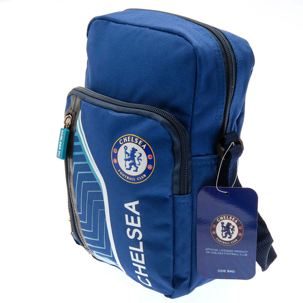 Chelsea FC Flash Shoulder Bag LKT Sport Flash design shoulder bag featuring Chelsea text and club crestMain compartment has a large double zipped opening for easy access2 front zip pockets and interior open pocketAdjustable shoulder strapRubber zip pulls