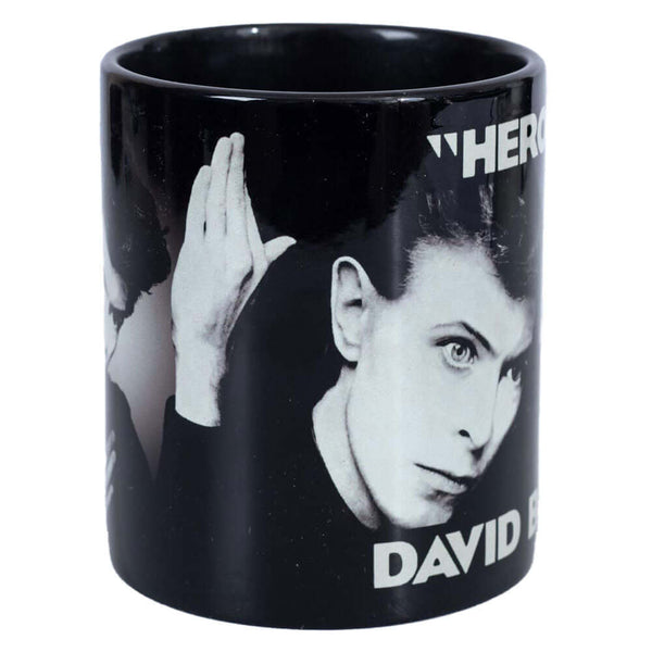 David Bowie Heroes Mug LKT Sport Ceramic everyday coffee mugFeatures the iconic 'Heroes' album coverGlazed kiln fired finish with black handleOfficial Licensed MerchandiseApprox 315ml (11oz)Approx 9cm tall, 8cm in diameter Mugs