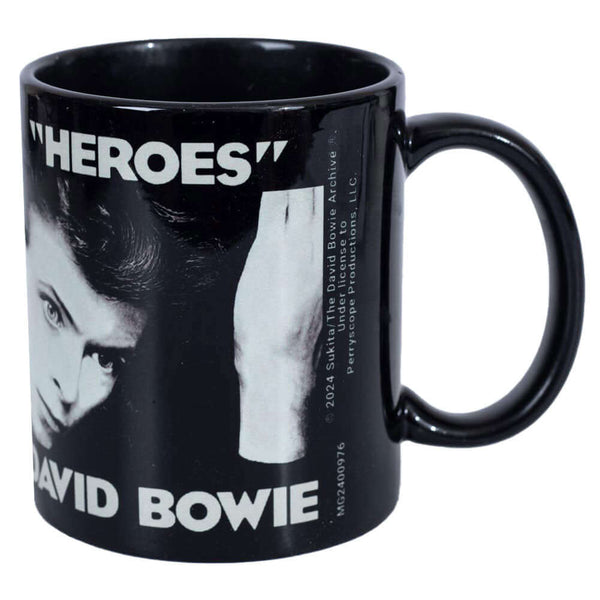 David Bowie Heroes Mug LKT Sport Ceramic everyday coffee mugFeatures the iconic 'Heroes' album coverGlazed kiln fired finish with black handleOfficial Licensed MerchandiseApprox 315ml (11oz)Approx 9cm tall, 8cm in diameter Mugs