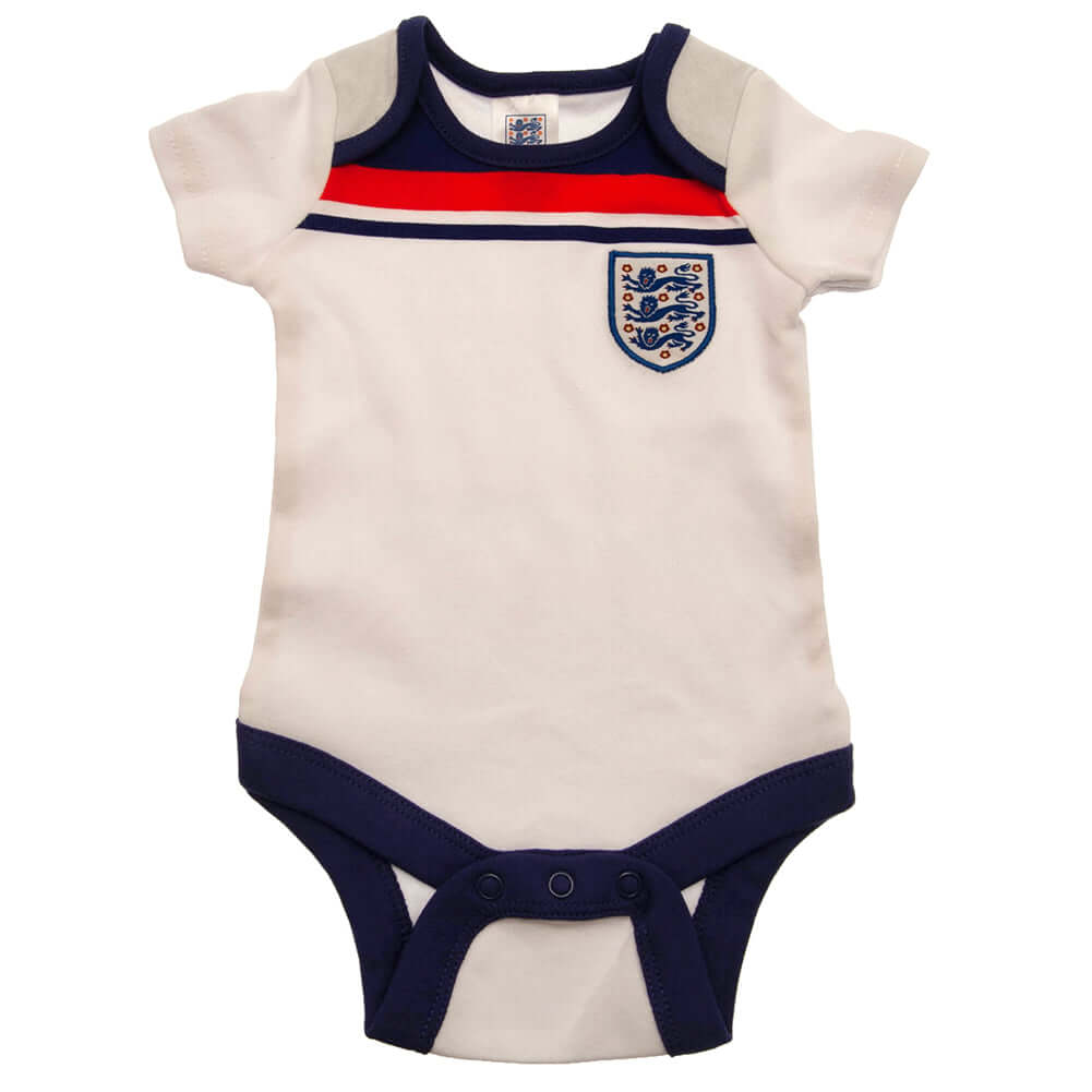 England FA 2 Pack Bodysuit 82 Retro 12-18 Mths LKT Sport This short sleeved bodysuit comes in a multi design twin packDesign inspired by the 1982 world cup kit with an embroidered crestSoft comfortable fit with press stud fasteningMade from 100% CottonOff