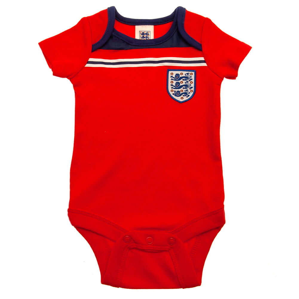 England FA 2 Pack Bodysuit 82 Retro 12-18 Mths LKT Sport This short sleeved bodysuit comes in a multi design twin packDesign inspired by the 1982 world cup kit with an embroidered crestSoft comfortable fit with press stud fasteningMade from 100% CottonOff