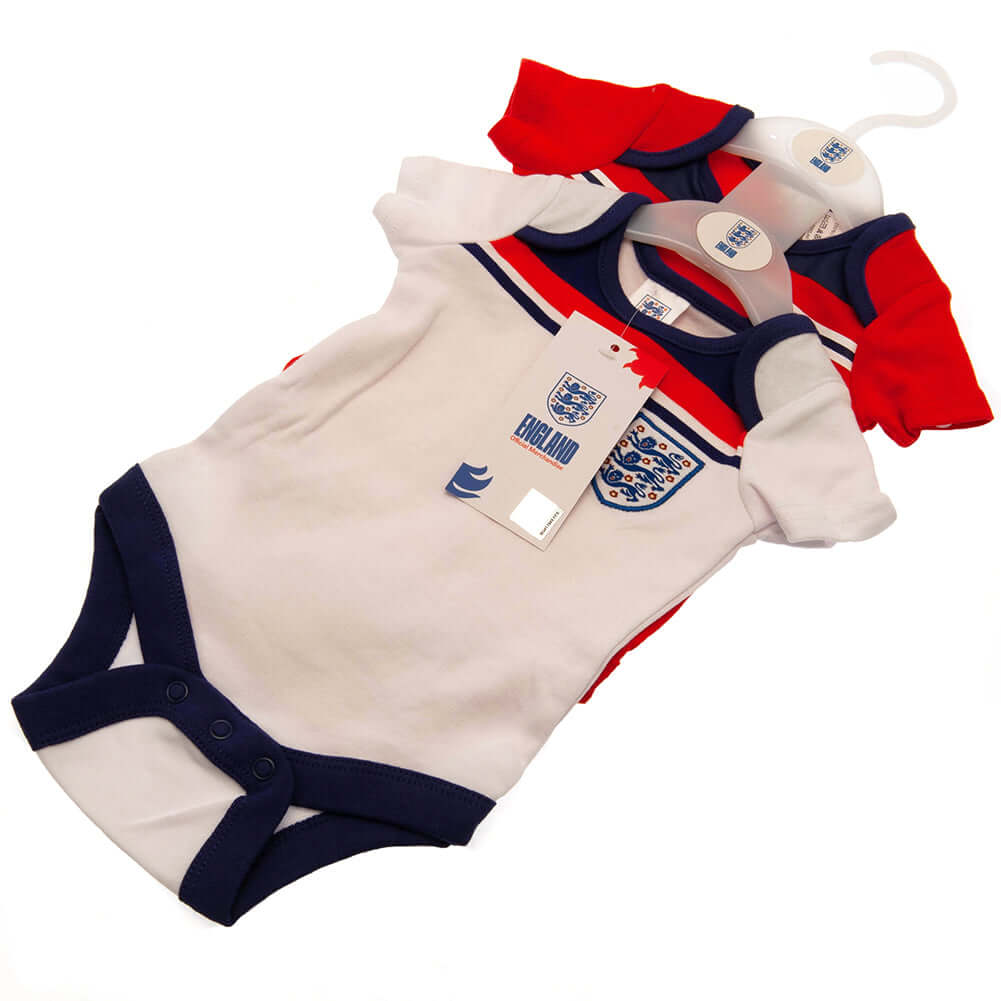 England FA 2 Pack Bodysuit 82 Retro 12-18 Mths LKT Sport This short sleeved bodysuit comes in a multi design twin packDesign inspired by the 1982 world cup kit with an embroidered crestSoft comfortable fit with press stud fasteningMade from 100% CottonOff
