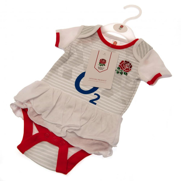 England RFU Tutu 6/9 mths LKT Sport This short sleeved tutu bodysuit features a double frill skirt design Design inspired by the 2020-21 season kit with an embroidered crest and printed sponsor Soft comfortable fit with press stud fastening Made from 100%