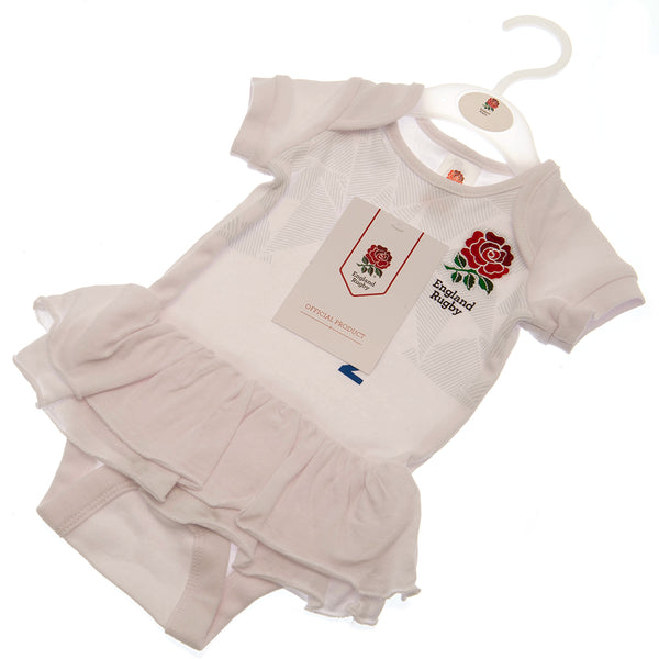 England RFU Tutu 9/12 mths PC LKT Sport This short sleeved tutu bodysuit features a double frill skirt designDesign inspired by the 2023-24 season kit with an embroidered crest and printed sponsorSoft comfortable fit with press stud fasteningMain: 100% Co