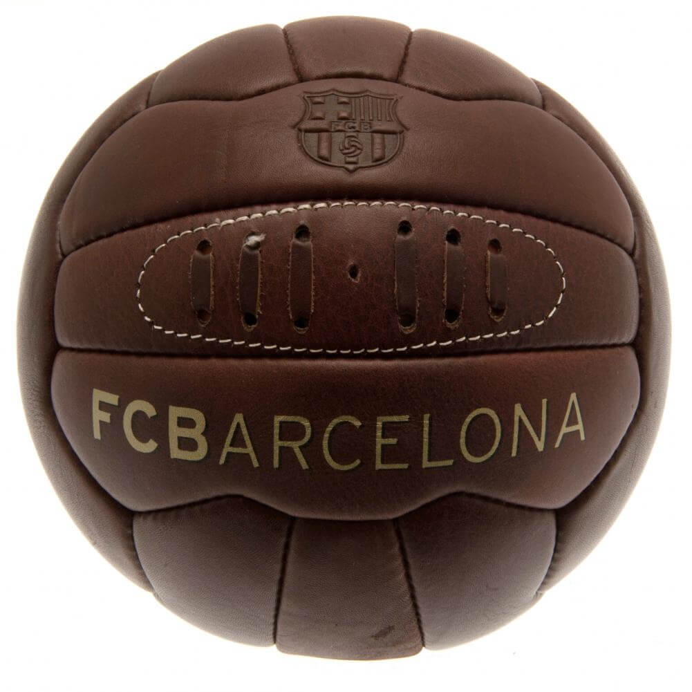FC Barcelona Retro Heritage Football LKT Sport Genuine leather heritage footballFeaturing gold debossed print Barcelona crest and text18 panel retro style ball with stitched featureOfficial licensed productSize 5 footballApprox 69cm in circumference Socce Main image