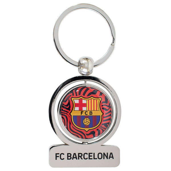 FC Barcelona Spinner Keyring LKT Sport Metal spinner keyring and split ringFeatures a spinning FCB logo, with Barca repeated on the reverseMetal alloy with silver style finishOfficial licensed productApprox 50mm x 40mm Keychains