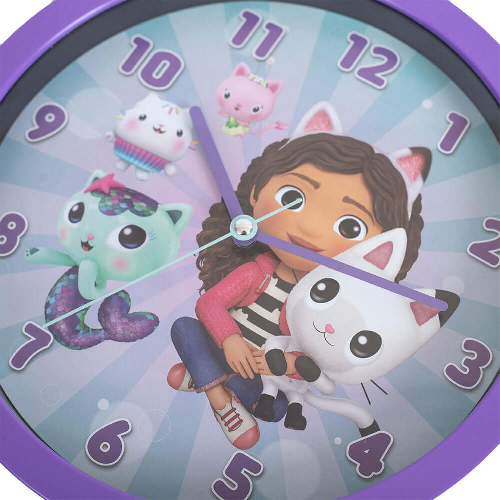Gabby's Dollhouse Wall Clock LKT Sport Colourful hanging wall clock featuring Gabby, Pandy, Cakey, Mercat and Kitty Fairy on the faceDurable plastic case with a clear font and modern quartz movementRequires x1 AA Battery (not included)Official licensed pr
