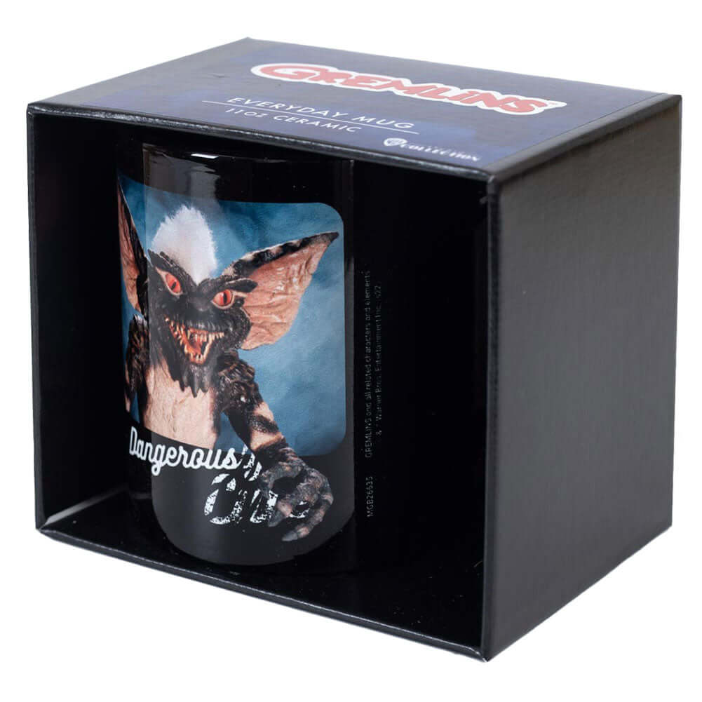 Gremlins Dangerously Cute Mug LKT Sport Ceramic everyday coffee mugBlack mug with two images of the 'Dangerously Cute' GremlinsGlazed kiln fired finishOfficial licensed productApprox 315ml (11oz)Approx 9cm tall, 8cm in diameter Mugs