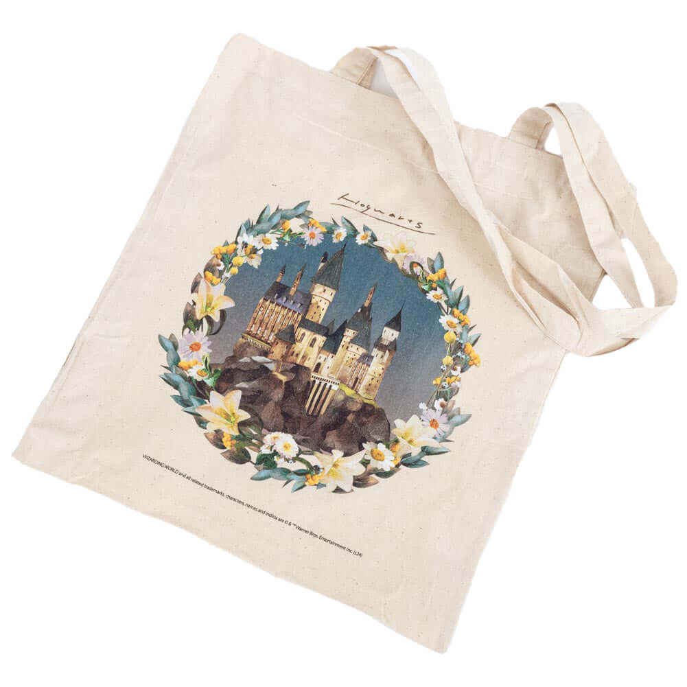 Harry Potter Hogwarts Castle Canvas Tote Bag LKT Sport Cream tote bag featuring a picturesque image of Hogwarts surrounded by pretty flowersMade from 100% Cotton canvas materialOfficial licensed productApprox 41cm x 37cm Tote Bags