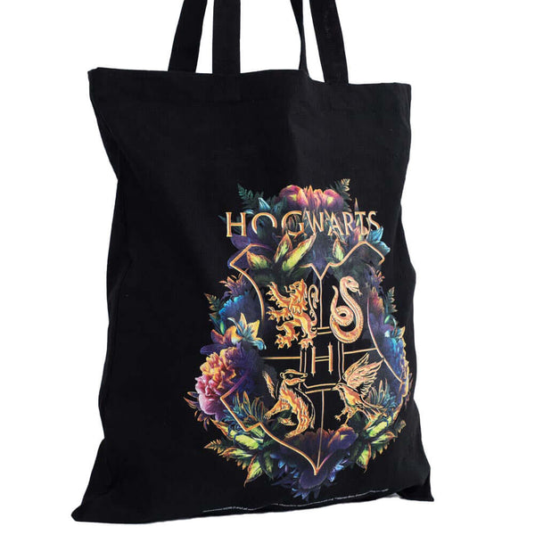 Harry Potter Hogwarts Crest Canvas Tote Bag LKT Sport Black canvas tote bag featuring a large gold printed Hogwarts crest surrounded by colourful flowersMade from 100% Cotton canvas materialOfficial licensed productApprox 41cm x 37cm Tote Bags