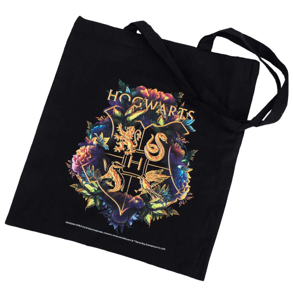 Harry Potter Hogwarts Crest Canvas Tote Bag LKT Sport Black canvas tote bag featuring a large gold printed Hogwarts crest surrounded by colourful flowersMade from 100% Cotton canvas materialOfficial licensed productApprox 41cm x 37cm Tote Bags