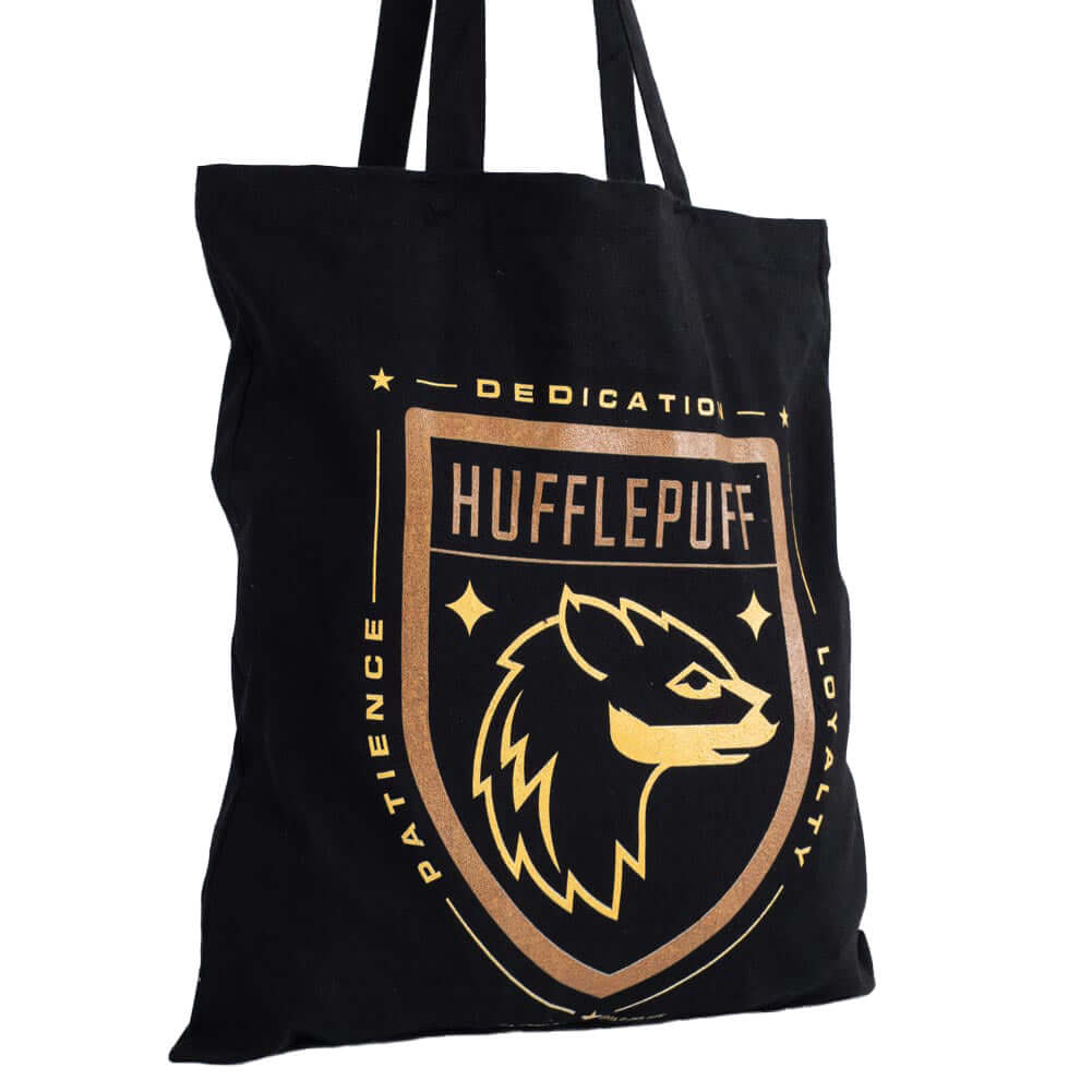 Harry Potter Hufflepuff Canvas Tote Bag LKT Sport Black canvas tote bag featuring a large gold printed Hufflepuff crest to one sideMade from 100% Cotton canvas materialOfficial licensed productApprox 41cm x 37cm Tote Bags